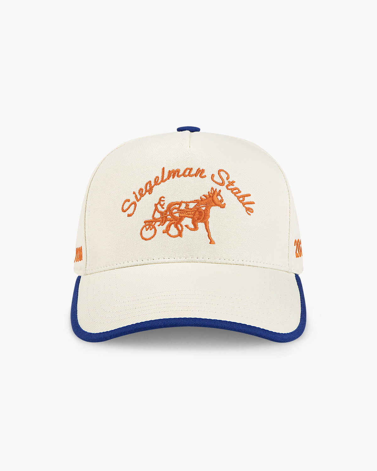 Front view of the 2026 New York Champions 5-panel hat, cream crown with royal blue trim and orange script and horse logo