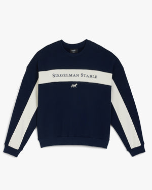 Front view of a navy retro crewneck with cream chest panel and sleeve stripes, Siegelman Stable text and horse logo
