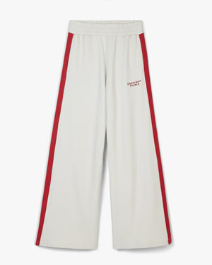 Front view of vaporous gray retro flared sweatpants with red side stripes and small red Siegelman Stable hip text