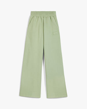 Front view of seafoam green emblem oversized wide leg sweatpants with elastic waist