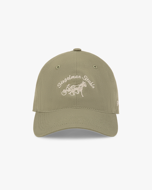 Front view of a taupe dad hat with ivory Siegelman Stable script and horse and sulky embroidery