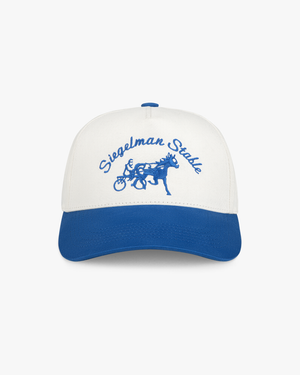 Front view of a pale gray and cobalt two-tone 5-panel hat with cobalt Siegelman Stable script and horse and sulky embroidery
