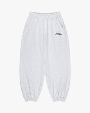 Front view of heather grey sweatpants with small black Siegelman Racing Stable text at the left hip