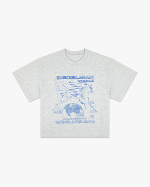 Front view of the heather gray Harnessing World-Class boxy tee with blue Siegelman Stable globe and horse graphic