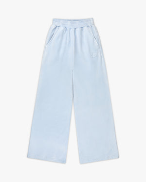 Front view of celestial blue emblem oversized wide leg sweatpants with elastic waist