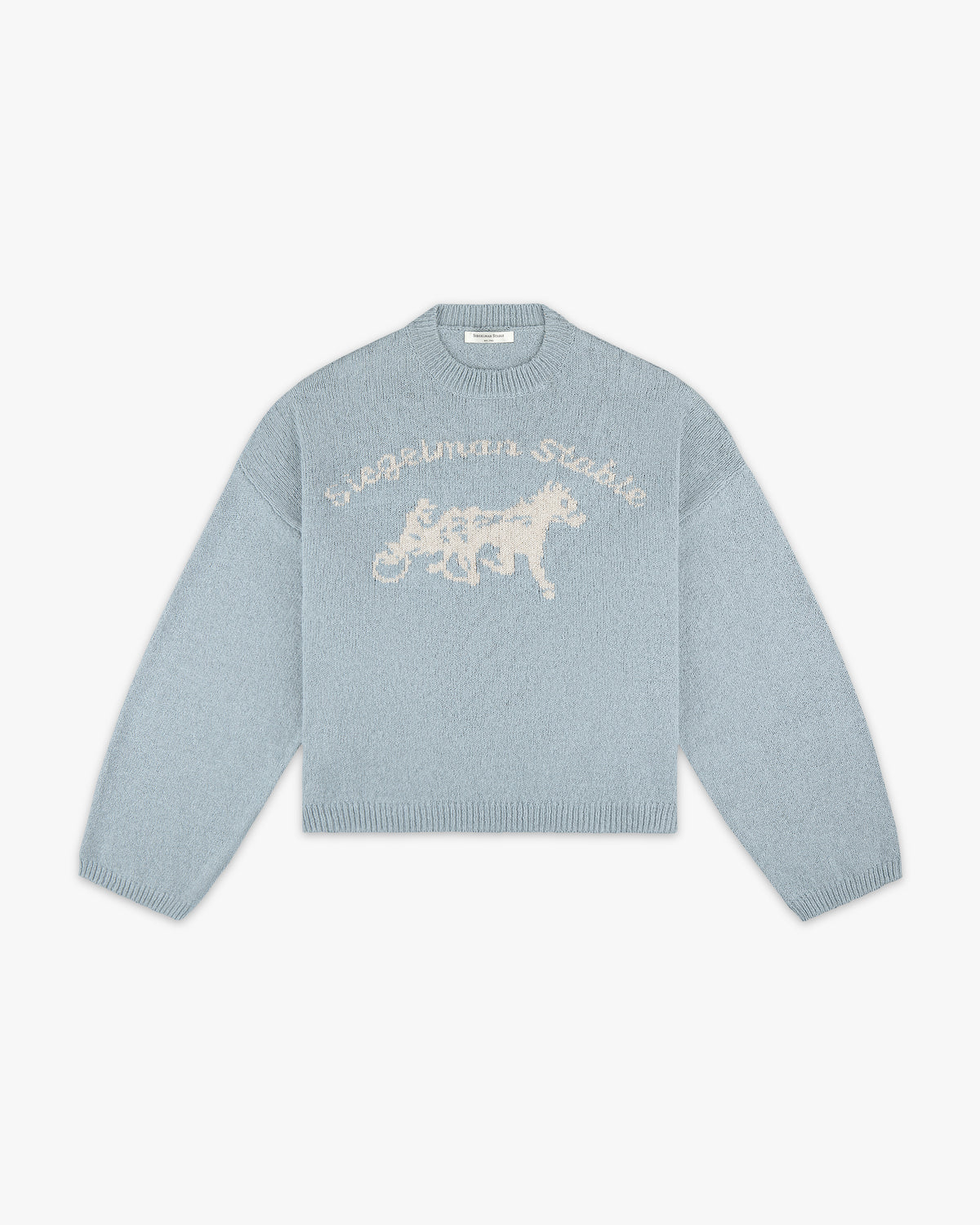 Front view of a dusty blue knit sweater with cream Siegelman Stable script and horse and sulky logo