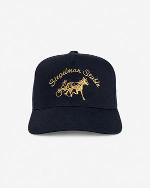 Front view of a dark navy 5-panel cap with 24K gold Siegelman Stable script and horse and sulky embroidery