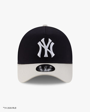 Front view of the New York Yankees x Siegelman Stable 9FORTY A-Frame snapback, navy crown with white NY logo and stone visor