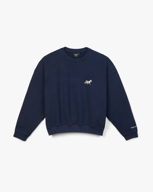 Front view of a navy crewneck with small silver horse and sulky embroidery on the chest and cuff text