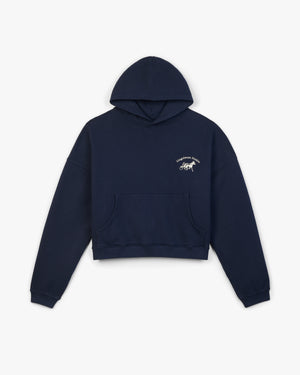 Front view of a navy hoodie with silver Siegelman Stable script and horse and sulky embroidery on the chest