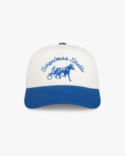 Front view of a pale gray and cobalt two-tone 5-panel hat with cobalt Siegelman Stable script and horse and sulky embroidery