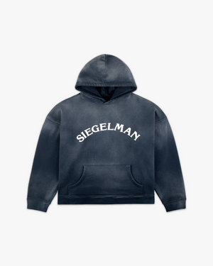 Front view of a navy enzyme-wash Racing Stable hoodie with arched white Siegelman lettering and kangaroo pocket
