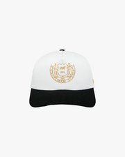 Front view of a white and black Heritage Crest 5-panel pro cap with gold Siegelman Stable crest