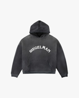 Front view of a black enzyme-wash Racing Stable hoodie with arched white Siegelman lettering and kangaroo pocket