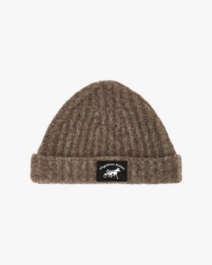 Front view of a heather brown ribbed knit beanie with folded cuff and black horse and sulky logo patch