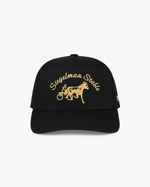 Front view of a black 5-panel cap with 24K gold Siegelman Stable script and horse and sulky embroidery
