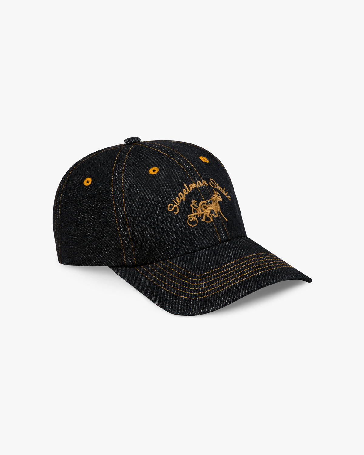 Three-quarter view of the black denim dad hat with gold contrast stitching on the visor and gold logo