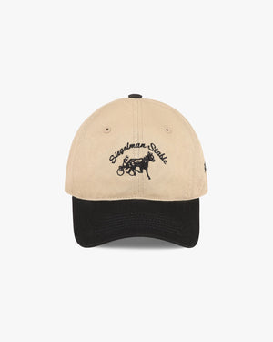 Front view of a khaki and black two-tone dad hat with black Siegelman Stable script and horse and sulky embroidery