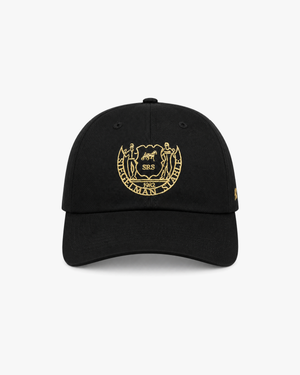 Front view of a black Heritage Crest dad hat with gold Siegelman Stable crest embroidery
