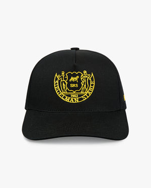 Front view of a black 5-panel cap with yellow-gold Siegelman Stable heritage crest embroidery