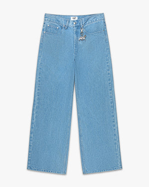Front view of light wash denim wide leg coaches pants with a silver keychain at the belt loop