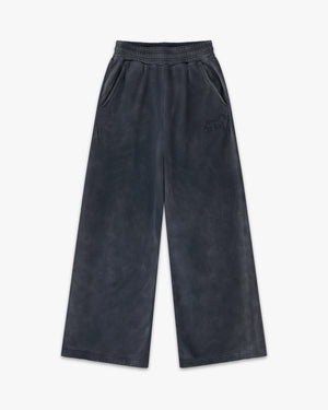 Front view of washed jet black emblem oversized wide leg sweatpants with elastic waist