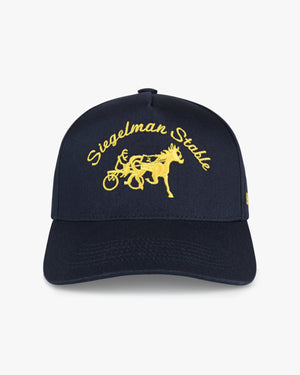 Front view of a navy 5-panel cap with university yellow Siegelman Stable script and horse and sulky embroidery