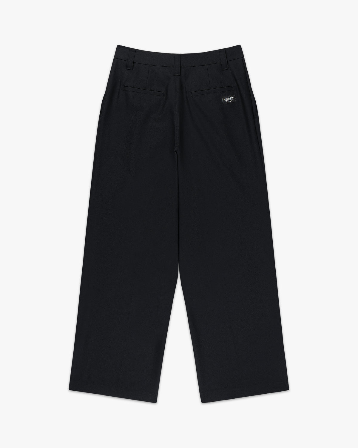 Back view of the black pleated wide leg trousers with a small logo label at the back pocket