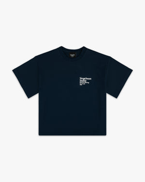 Front view of a navy boxy tee with small white Siegelman Stable Harness Racing text on the chest