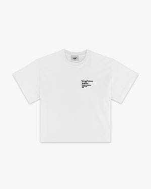 Front view of a white boxy tee with small black Siegelman Stable Harness Racing text on the chest