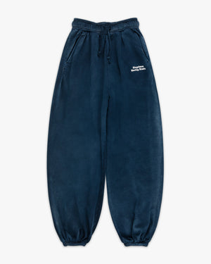 Front view of navy enzyme-wash sweatpants with white Siegelman Racing Stable text at the left hip